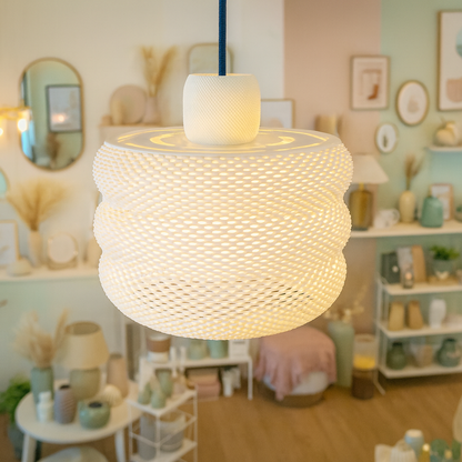 Woven pendant light in a room with decor elements