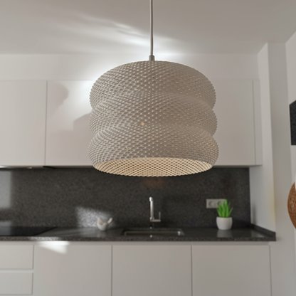 White woven pendant lamp above a sleek kitchen with a dark countertop.