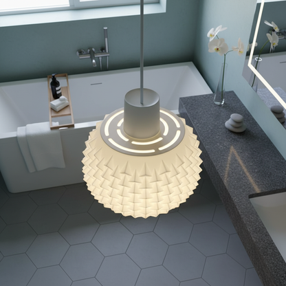 Close-up view of a white geometric pendant lamp illuminating a contemporary bathroom vanity.