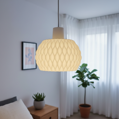 Decorative pendant light in a room with plants and a bed.
