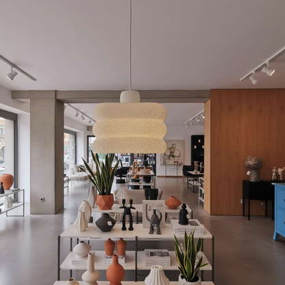 Textured modern pendant lamp creating cozy ambient lighting in a stylish room