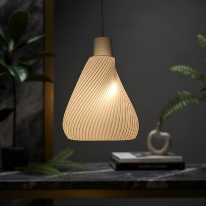 Spiral ribbed pendant lamp with warm glow hanging above a dark stone surface in a modern interior with plants.