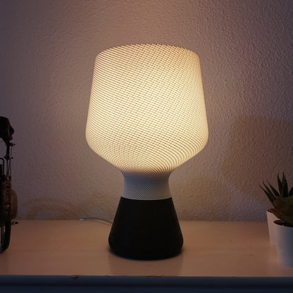 Textured table lamp on a surface with a neutral background