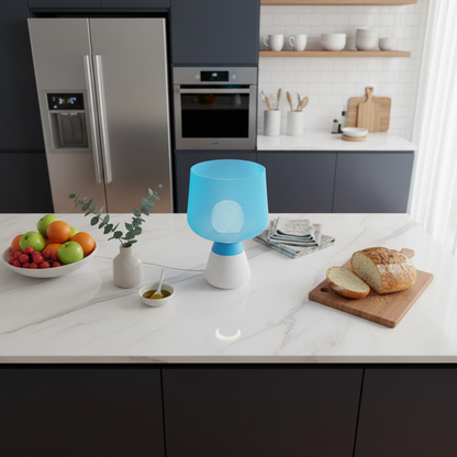 Modern kitchen with a blue and white lamp on a marble countertop.
