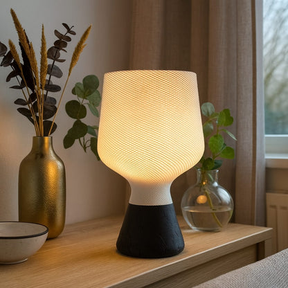 Lamp on a wooden surface with decorative elements in a home setting