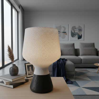 Modern lamp on a table in a living room with a sofa and decor.