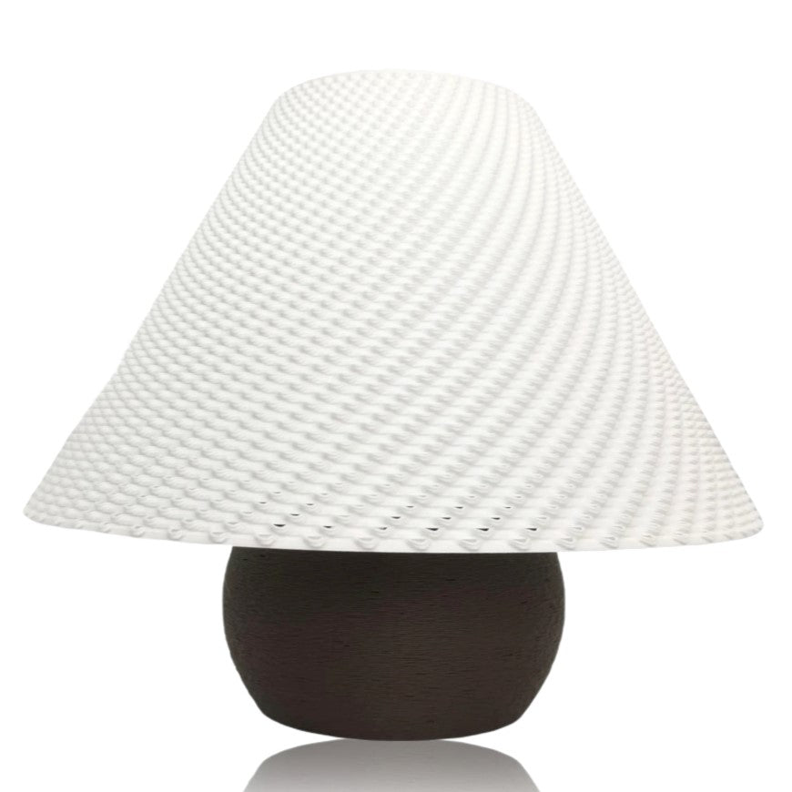 Decorative lamp with a textured white shade and brown base on a white background