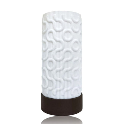 White textured cylindrical table lamp with a brown base on a white background