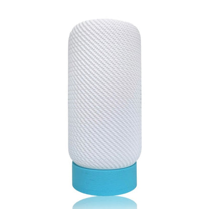 Textured white cylindrical table lamp with a blue base on a white background