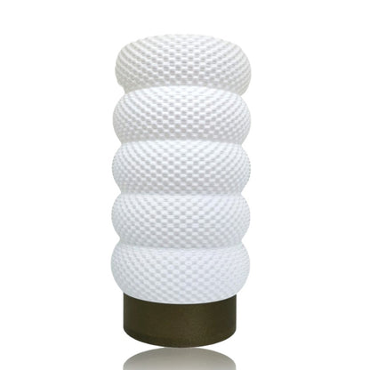 Decorative lamp with textured design on a white background
