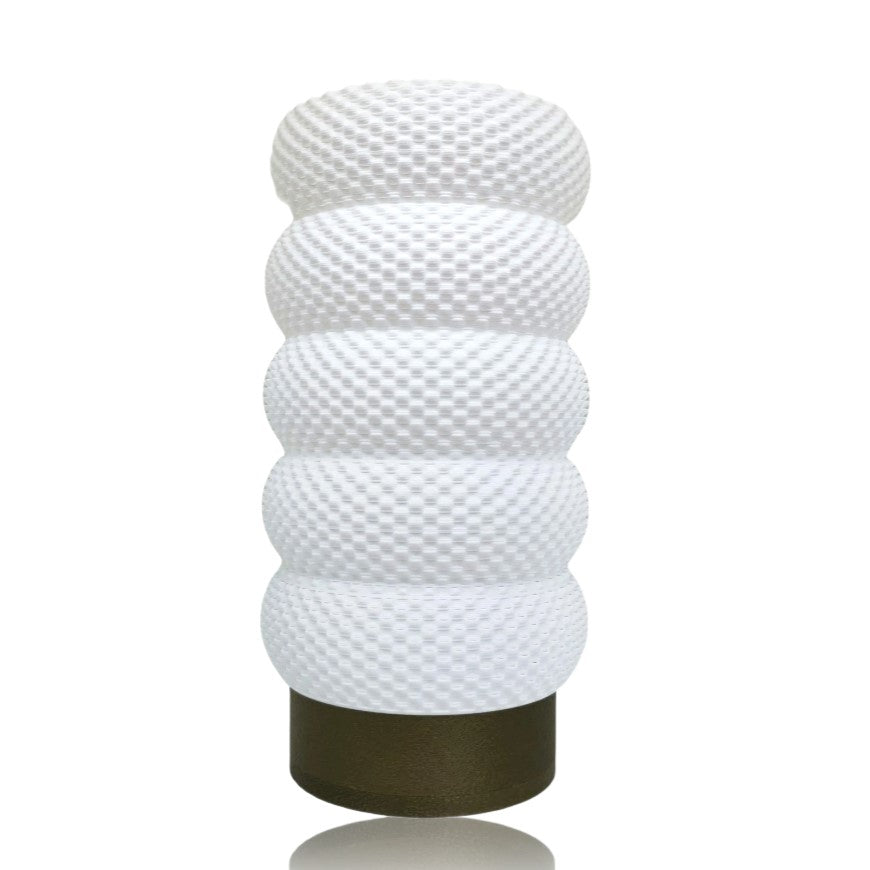 Decorative lamp with textured design on a white background