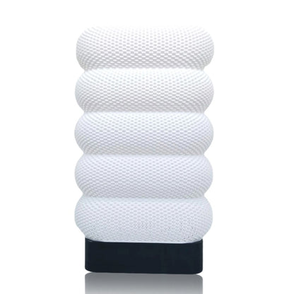 White textured table lamp on a white background