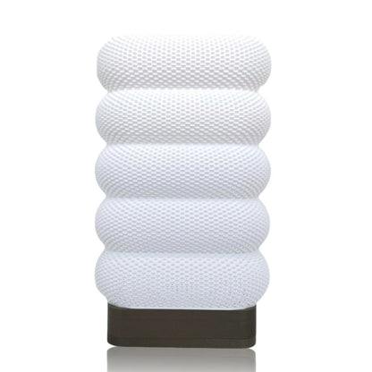 White textured cylindrical table lamp on a white background