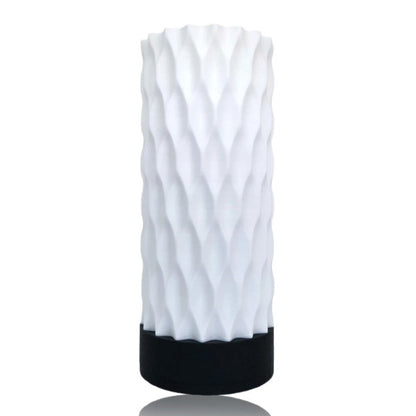 White textured table lamp with black base on a white background