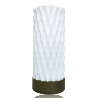 White textured table lamp with a gold base on a white background
