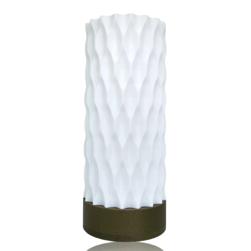 White textured table lamp with a gold base on a white background