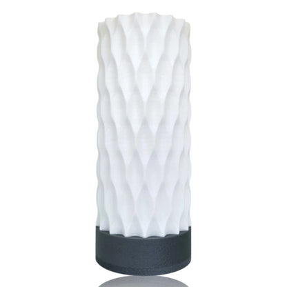 White textured table lamp with silver base on a white background