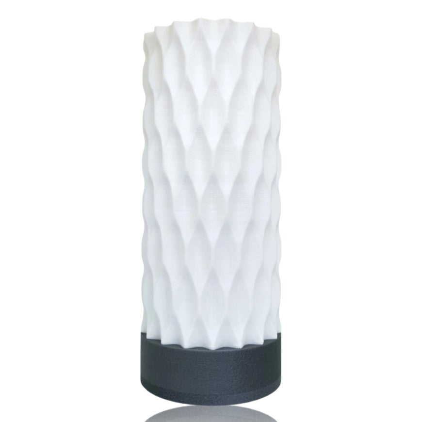 White textured table lamp with silver base on a white background