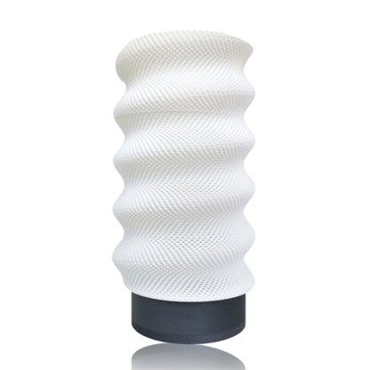 White textured table lamp on a white background