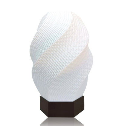 Decorative white lamp with textured design on a white background