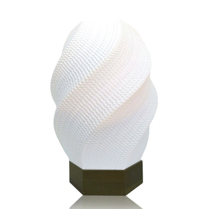 Decorative lamp with textured white shade and gold base on a white background