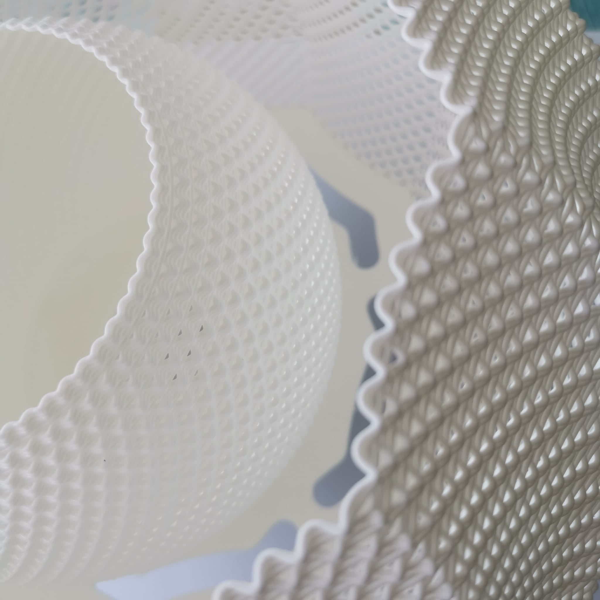 Close-up of textured white pendant lamp.