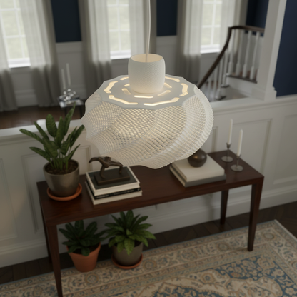 White sculptural pendant light with an open textured pattern hanging above a console table in a classic interior setting.