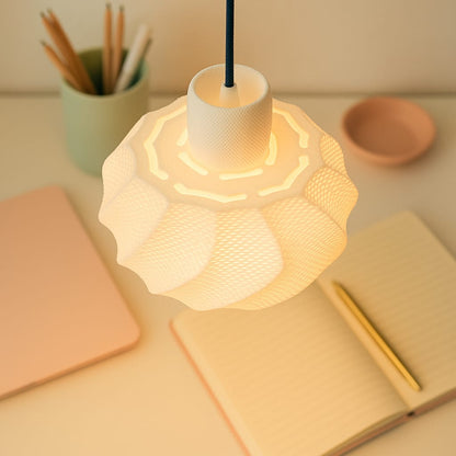 Decorative lamp on a desk with notebooks and pencils