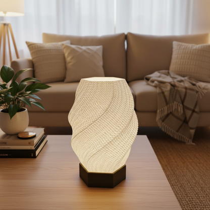Decorative table lamp on a wooden surface with a living room in the background