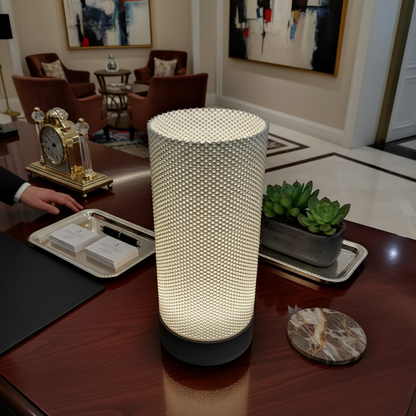 Decorative lamp on a table in a stylish room with art and decor.