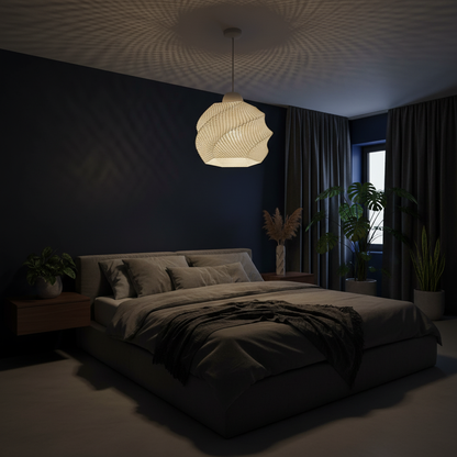 Dark bedroom with a bed, lamp, and plants under a textured ceiling.